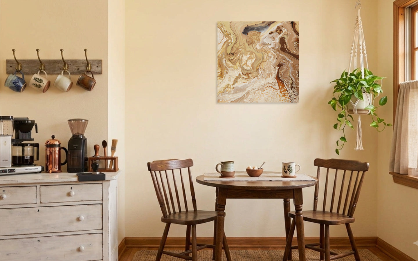 Square abstract acrylic painting in warm sand, caramel, cream and gold, shifting dune-like texture with a carved channel displayed in coffee corner