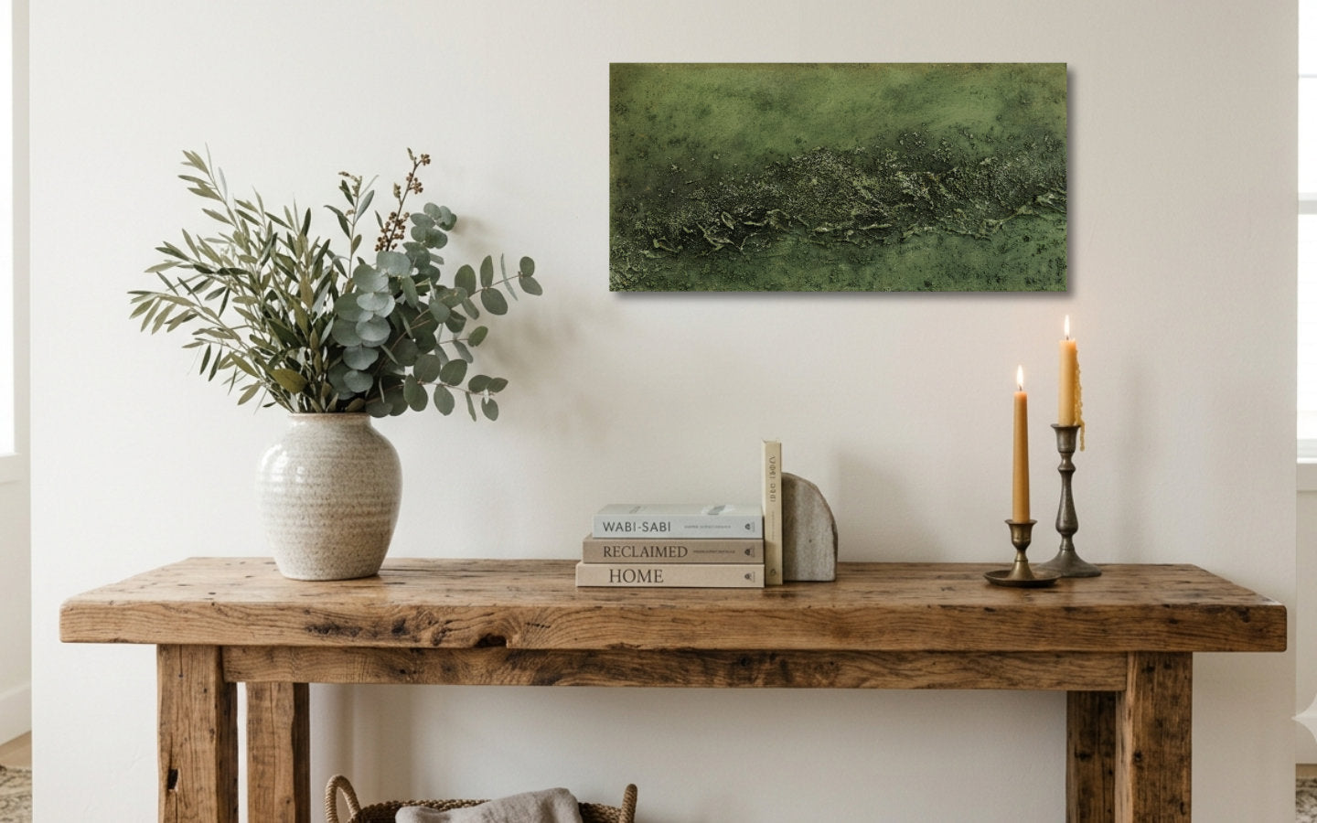 Landscape textured abstract acrylic painting in muted olive and sage green with a raised crusted ridge, land seen from high above displayed above a console table