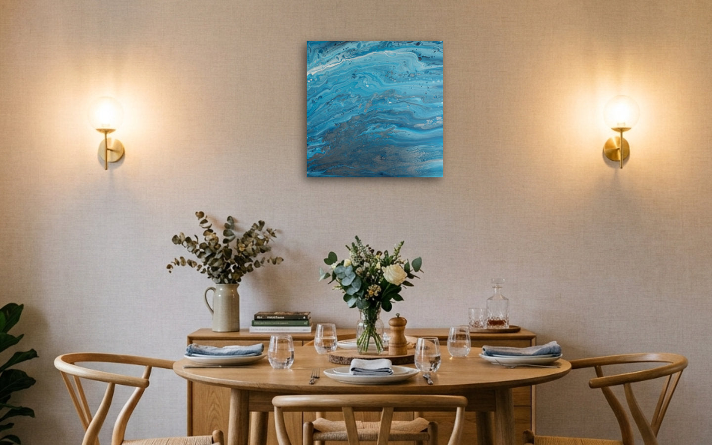 Square abstract acrylic painting in bright blue over stony pewter tones, clear shallow coastal water showing rock and sand below displayed in a dining room
